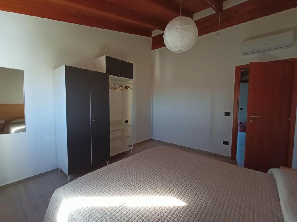 Postel nebo postele na pokoji v ubytování B&B Tra Gli Ulivi