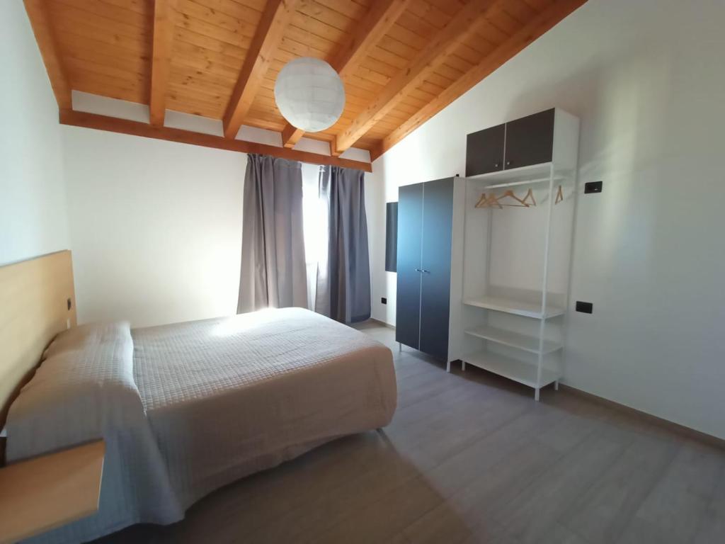 Postel nebo postele na pokoji v ubytování B&B Tra Gli Ulivi