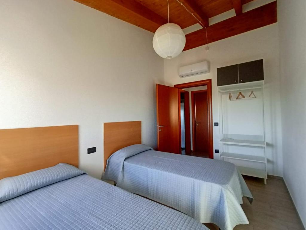 Postel nebo postele na pokoji v ubytování B&B Tra Gli Ulivi