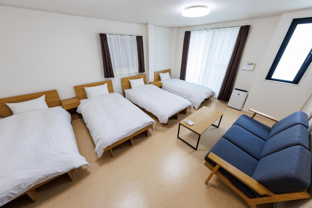 Postel nebo postele na pokoji v ubytování 5 minutes Shin-Osaka 3
