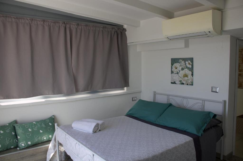 Postel nebo postele na pokoji v ubytování Casa sul Serapeo
