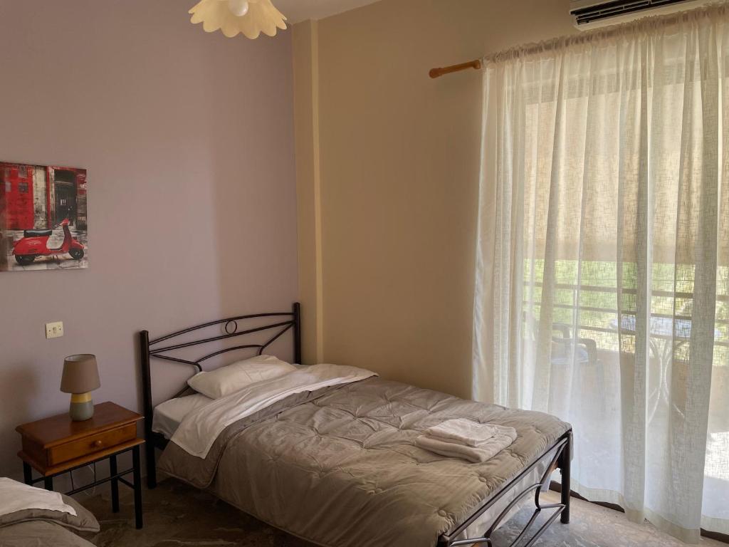 Postel nebo postele na pokoji v ubytování Finikas