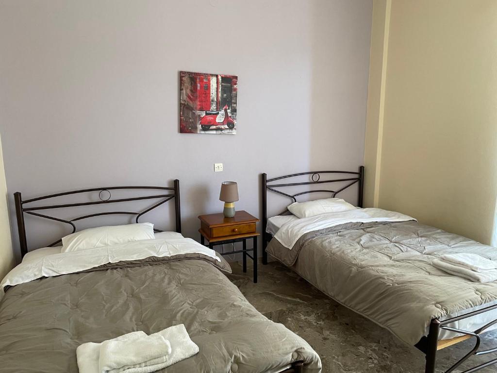 Postel nebo postele na pokoji v ubytování Finikas