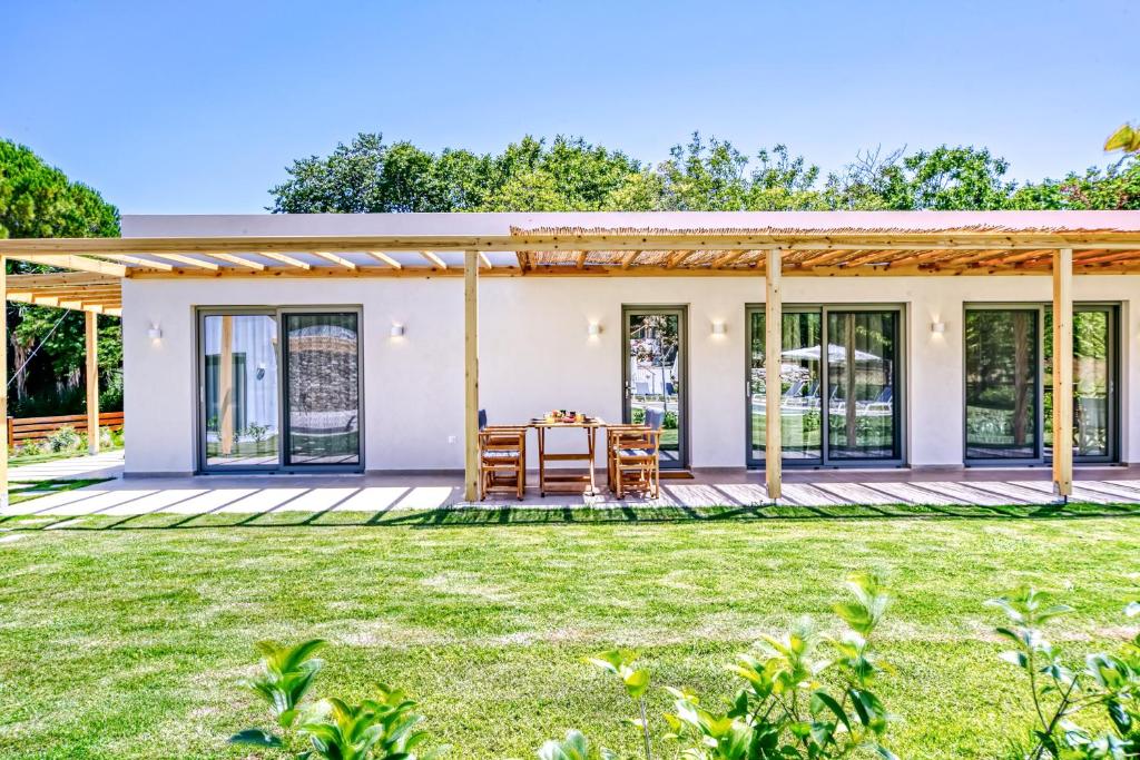 a home with a patio and grass yard at Kumquart estate- Bergamot in Aspiotádes