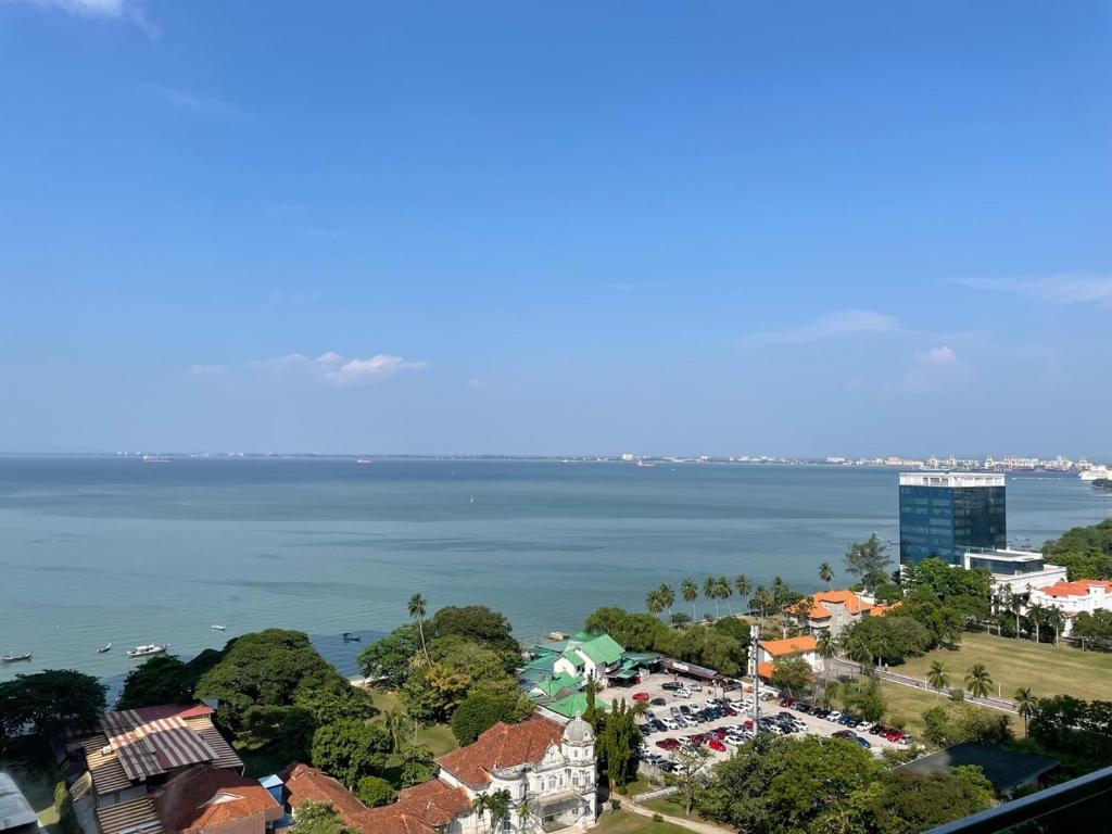 an aerial view of a city and the ocean at Penang Mansion One Suites By AuroraHomes in George Town