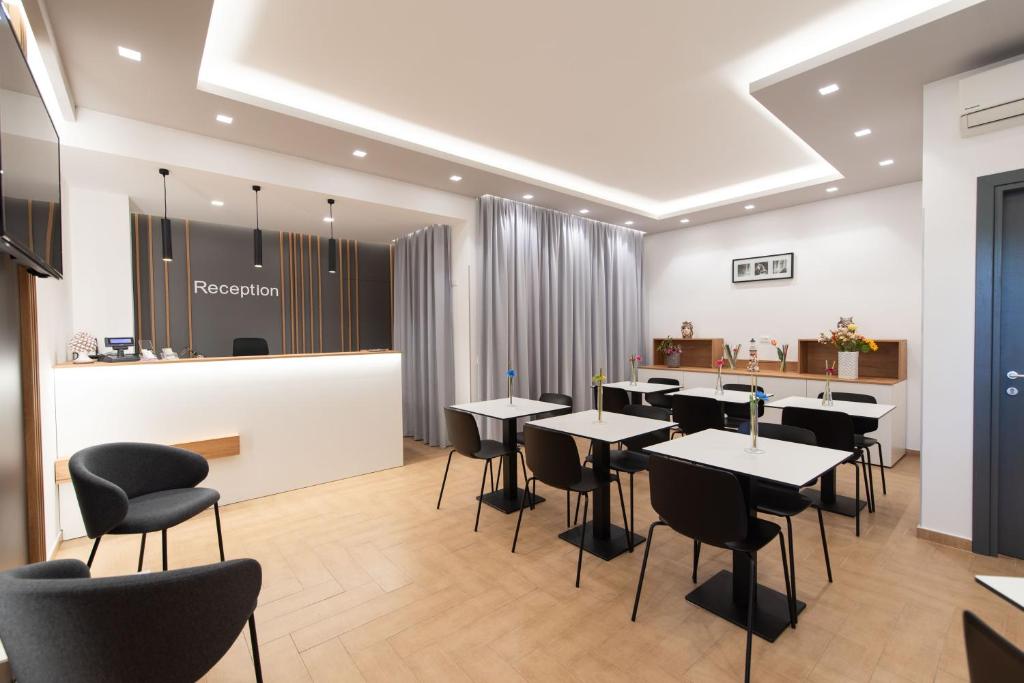 a restaurant with tables and chairs and a counter at Room & Breakfast Aloe in San Vito lo Capo