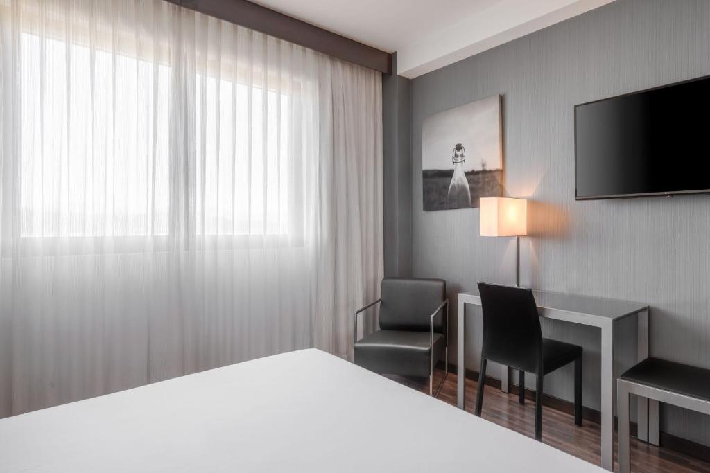 Postel nebo postele na pokoji v ubytování AC Hotel Vicenza by Marriott