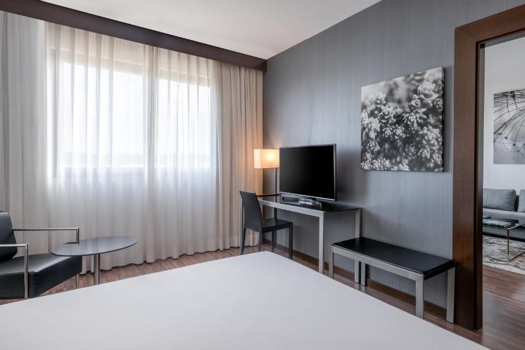 TV a/nebo společenská místnost v ubytování AC Hotel Vicenza by Marriott