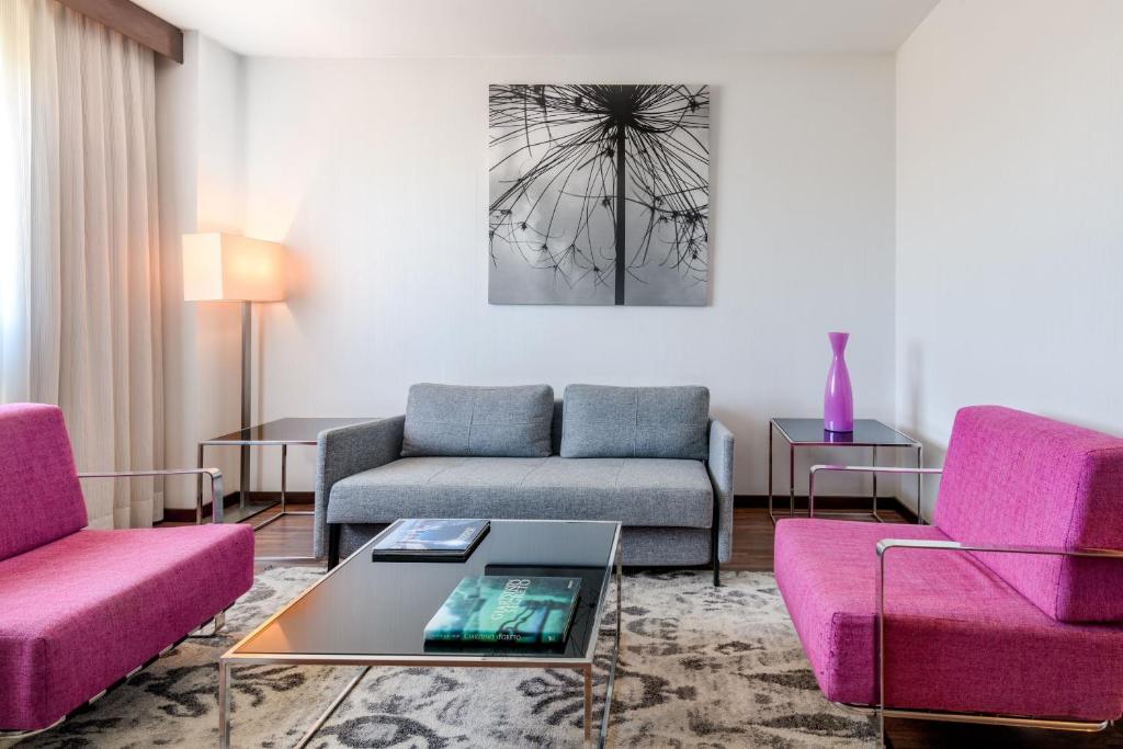 Posezení v ubytování AC Hotel Vicenza by Marriott
