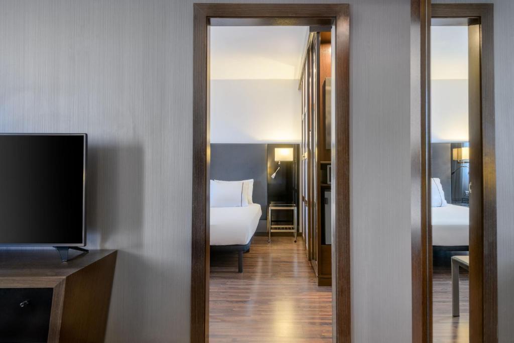 Postel nebo postele na pokoji v ubytování AC Hotel Vicenza by Marriott