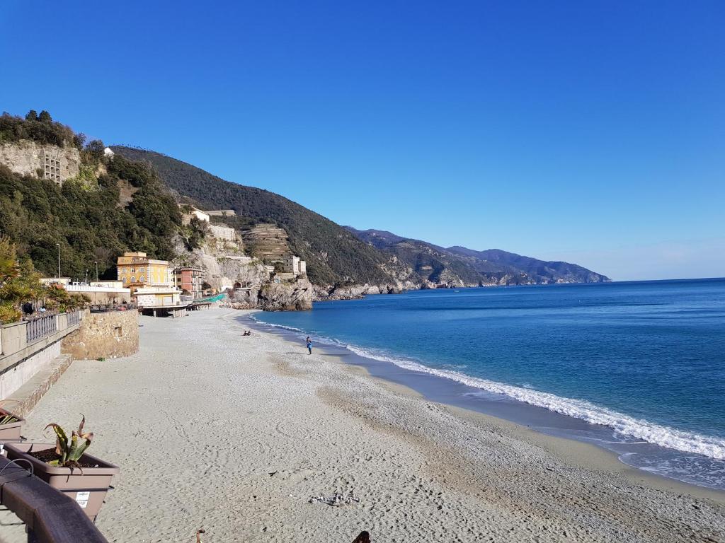 a view of a beach with the ocean at Ca Enrico luxury flat in Monterosso al Mare