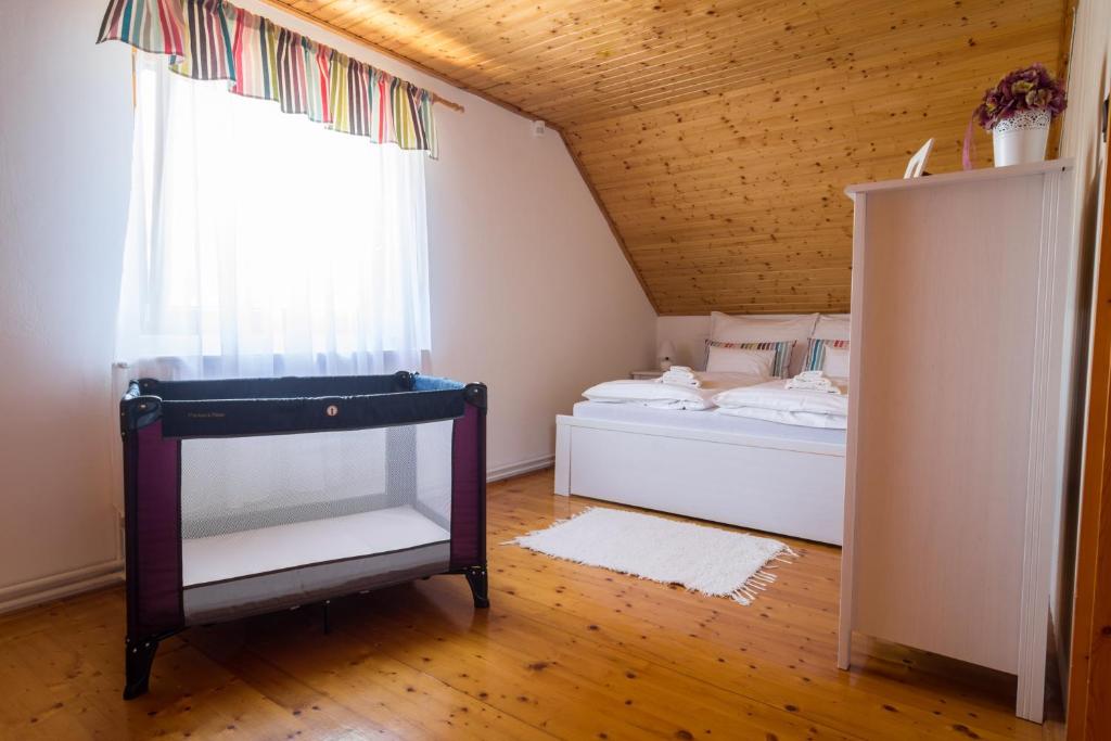Postel nebo postele na pokoji v ubytování BorászPorta