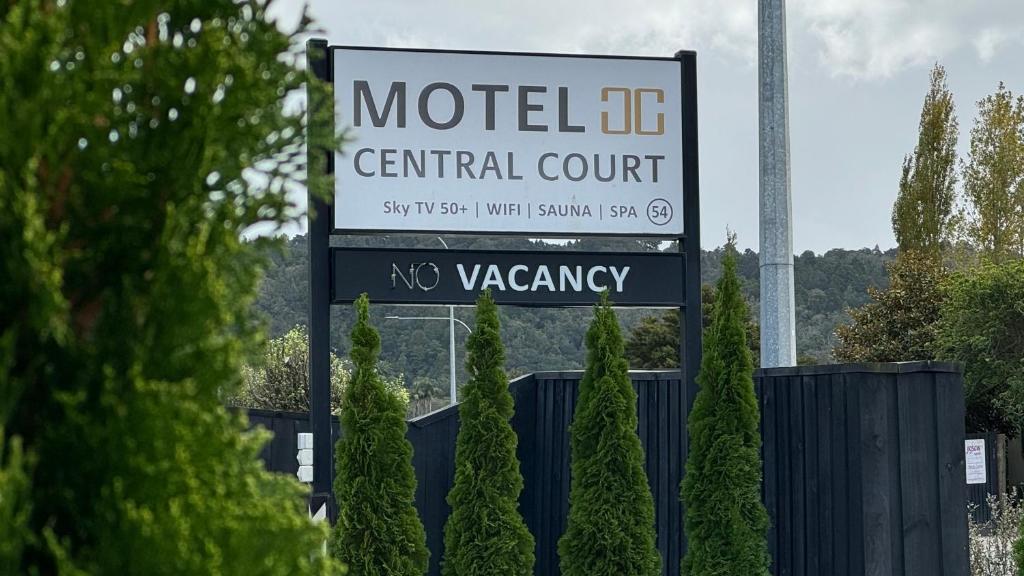a sign for a central court on a road at Central Court Motel in Whangarei