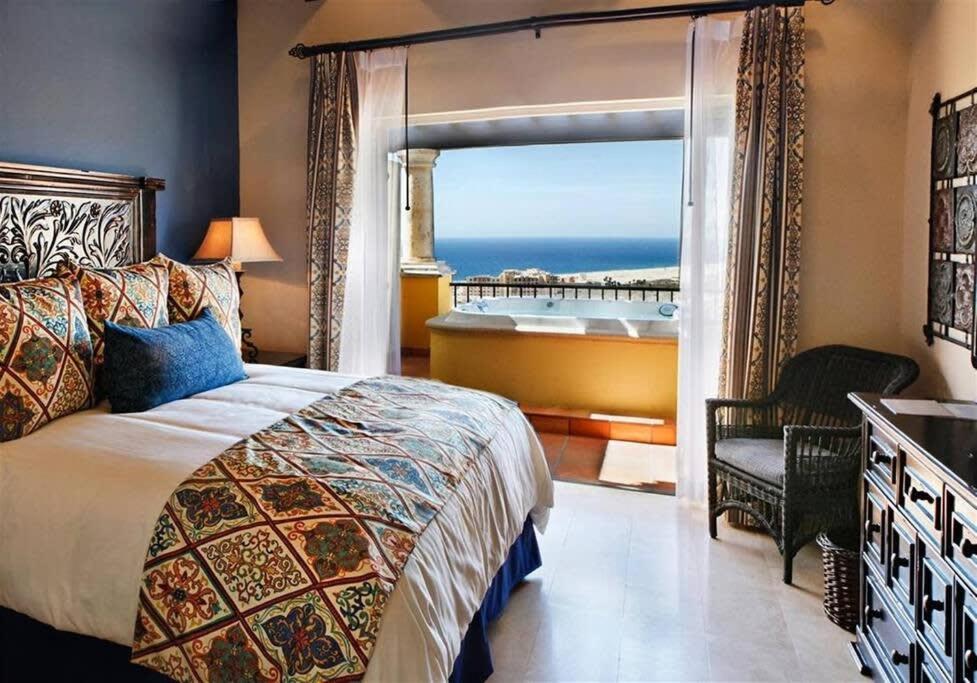 a bedroom with a bed and a view of the ocean at Four Fabulous 3BR Villa Unique View in Cabo in Cabo San Lucas