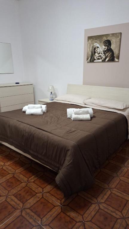 A bed or beds in a room at LA ROSA DEI VENTI