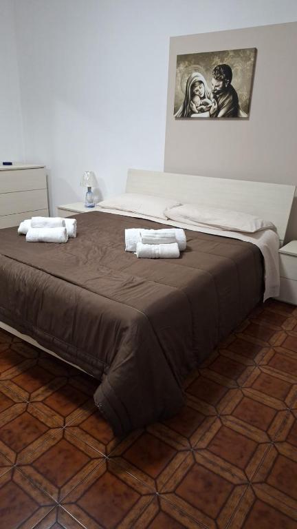 A bed or beds in a room at LA ROSA DEI VENTI