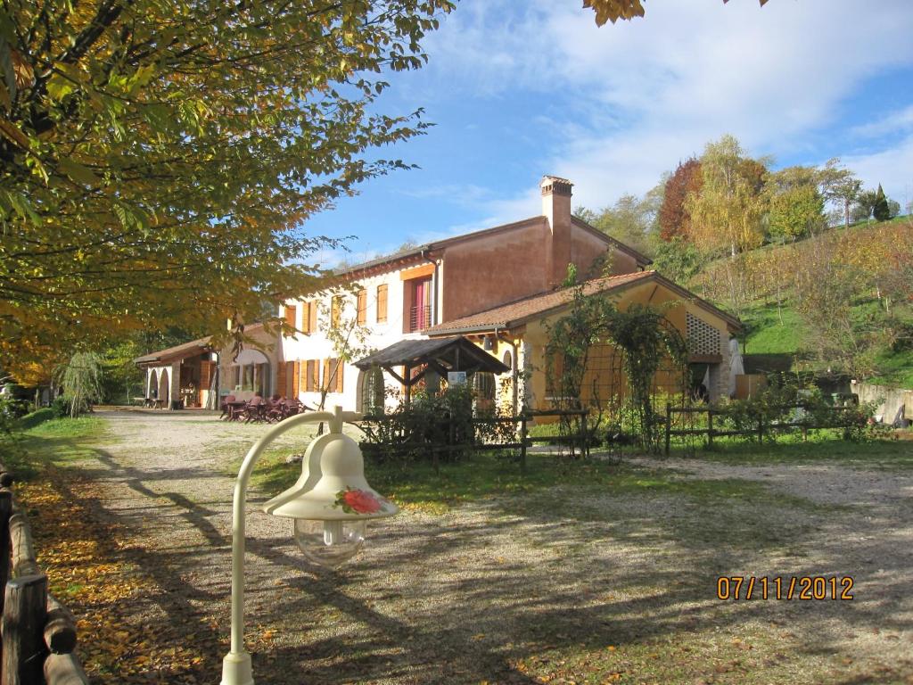 a duck statue in front of a house at La Valle in Nervesa della Battaglia
