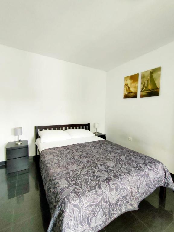 Postel nebo postele na pokoji v ubytování Rafael Apartments