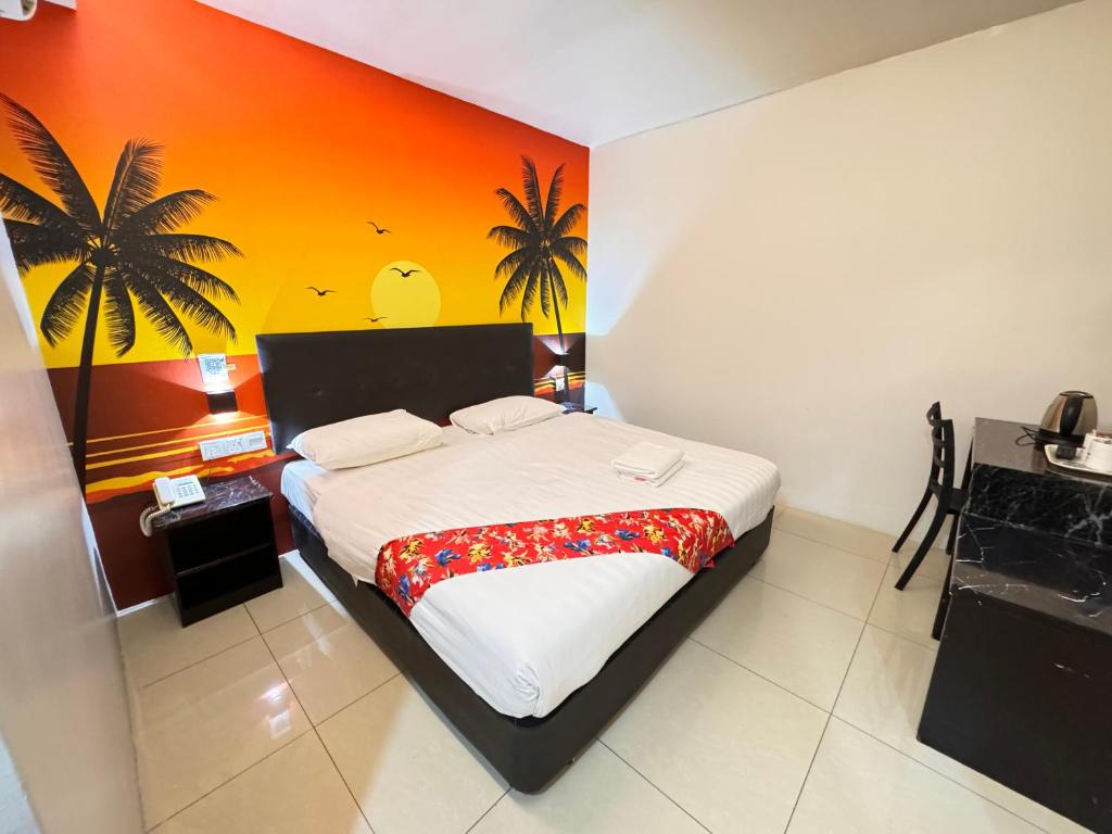 a bedroom with a bed with a colorful wall at Best View Hotel Sunway Mentari in Petaling Jaya