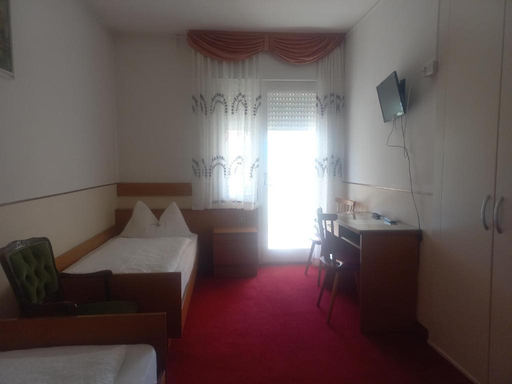 TV a/nebo společenská místnost v ubytování Hotel Lux