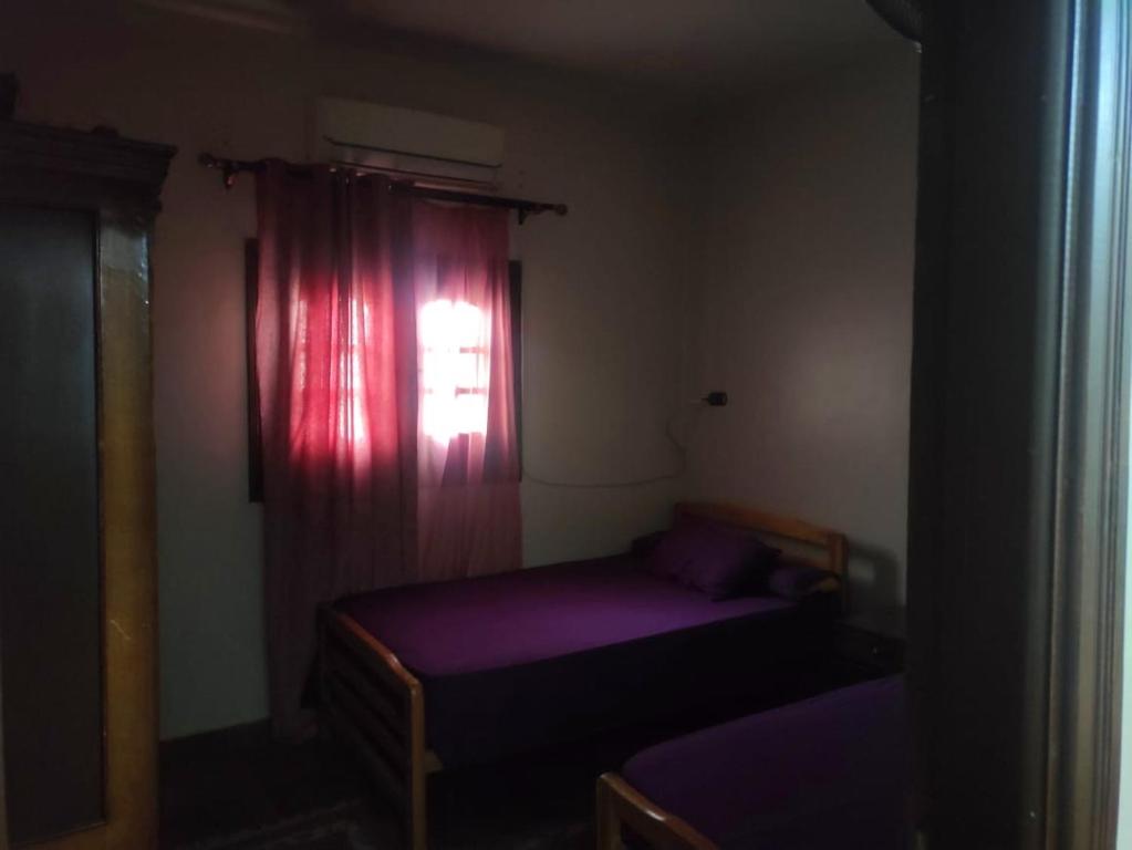 Una cama o camas en una habitación de Ahmed house