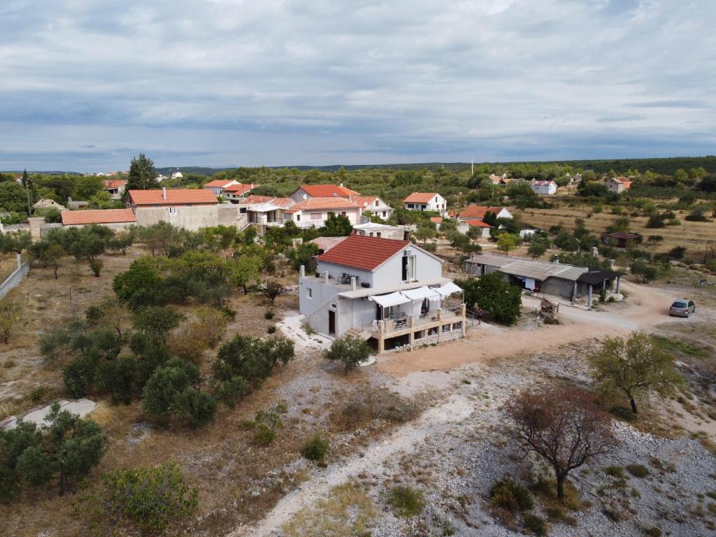 an aerial view of a village with a house at Panorama Studio in Skradin