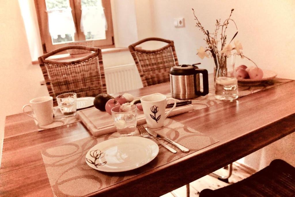 a wooden table with a plate of food on it at Ferienwohnung für 3 Personen ca 55 qm in Görlitz, Lausitz Lausitzer Seenland - b55639 in Görlitz