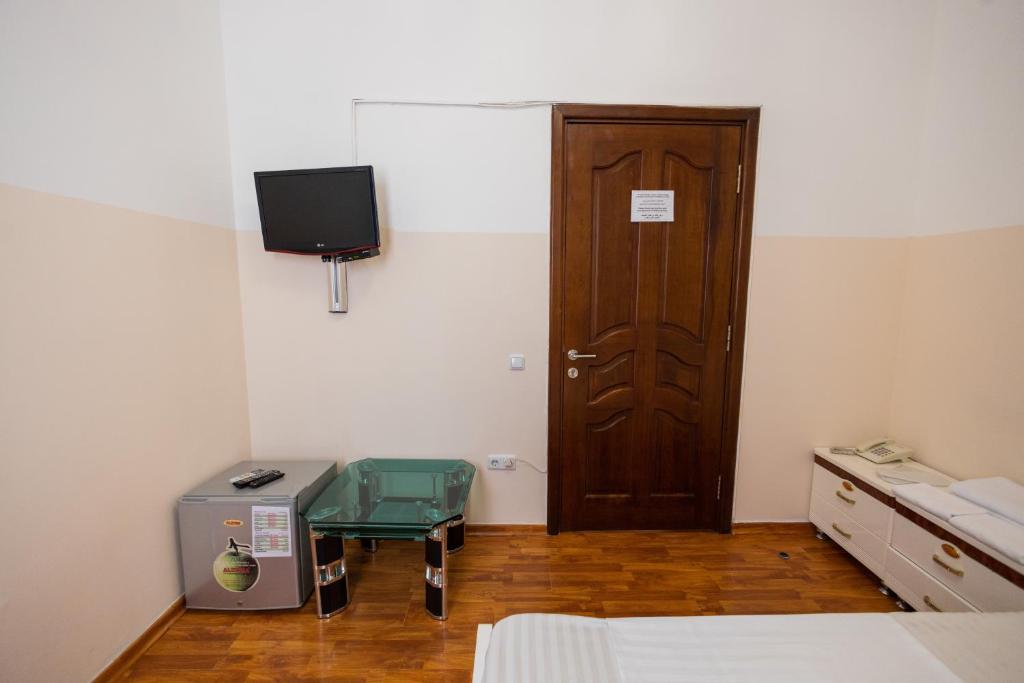 Postel nebo postele na pokoji v ubytování YAN HOTEL