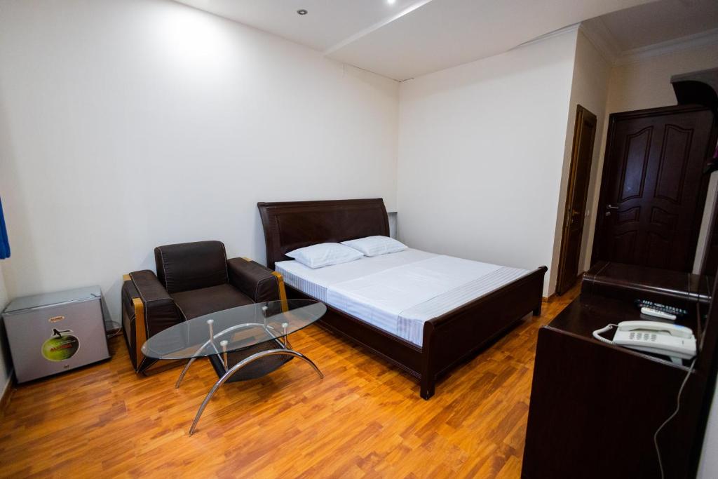 Postel nebo postele na pokoji v ubytování YAN HOTEL