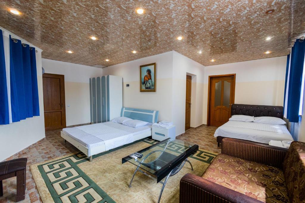 Postel nebo postele na pokoji v ubytování YAN HOTEL