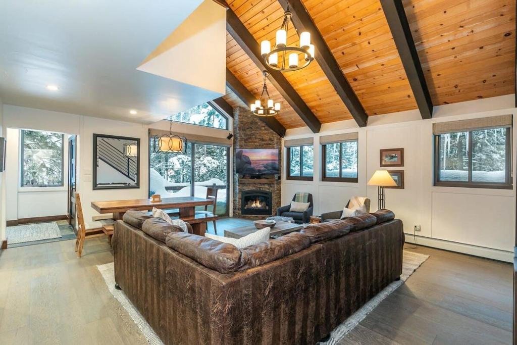 a large living room with a large brown couch at North Lake Tahoe Cabin and Hot Tub in Tahoe City