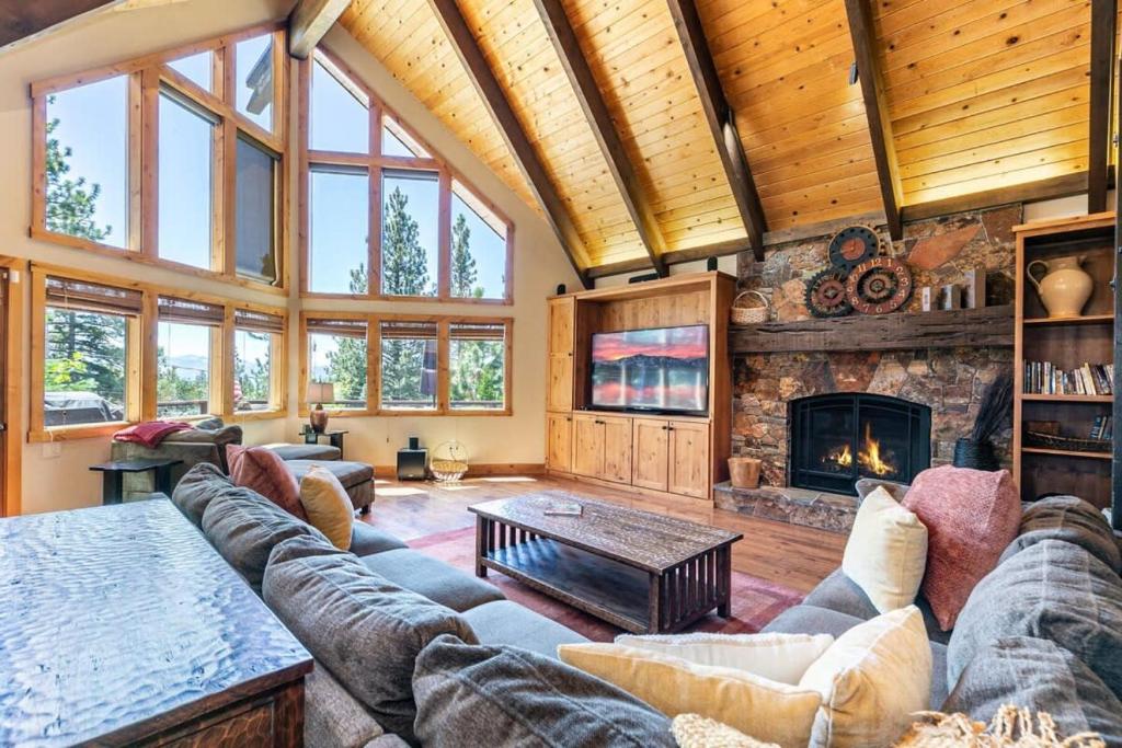 a living room with a couch and a fireplace at EJ's Point Walk to Beach in Tahoe City