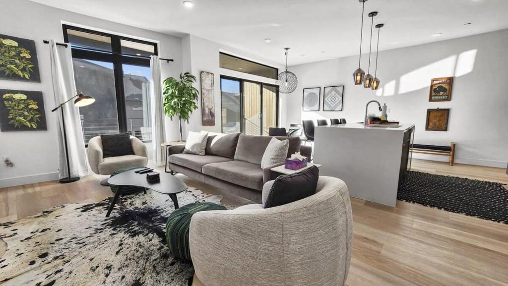 a living room with a couch and a table at 2BDR New Build Minutes to Dillon Reservoir in Silverthorne