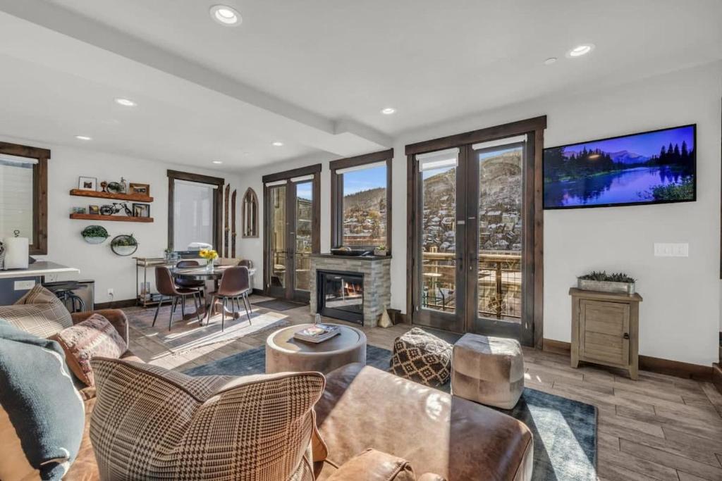 a living room with a couch and a table at 2BD Near Slopes and Town with Impressive Views in Park City