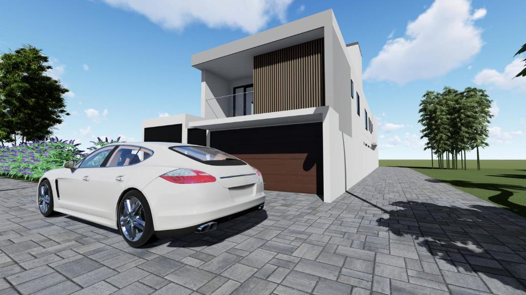 a white car parked in front of a house at Briques Luxes Constructions in Lomé