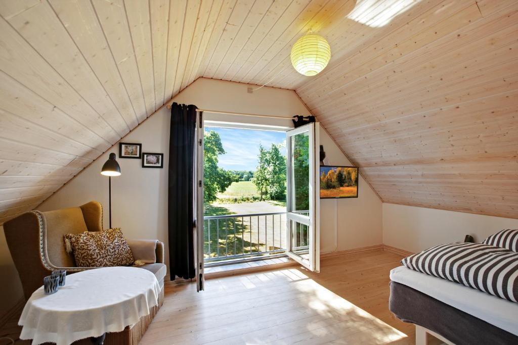 a room with a bed and a table and a window at Amalies Annex in Sorø