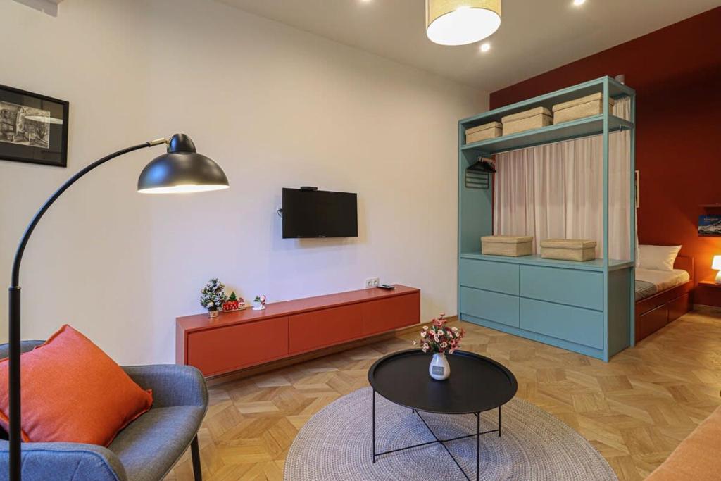 a living room with a couch and a bunk bed at Modern 1BR apt w balcony in old Tbilisi-By Wehost in Tbilisi City