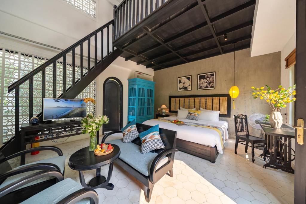 Postel nebo postele na pokoji v ubytování Nghé Garden Resort Hội An