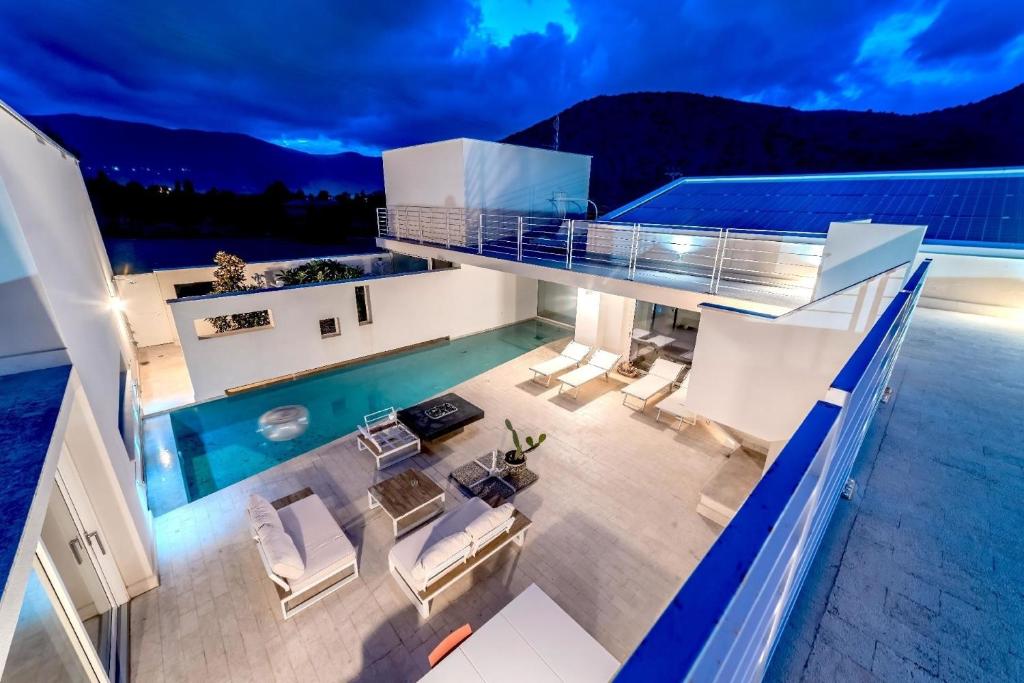 an overhead view of a house with a swimming pool at Ferienhaus mit Privatpool für 4 Personen ca 380 qm in Torretta, Sizilien Nordküste von Sizilien in Torretta