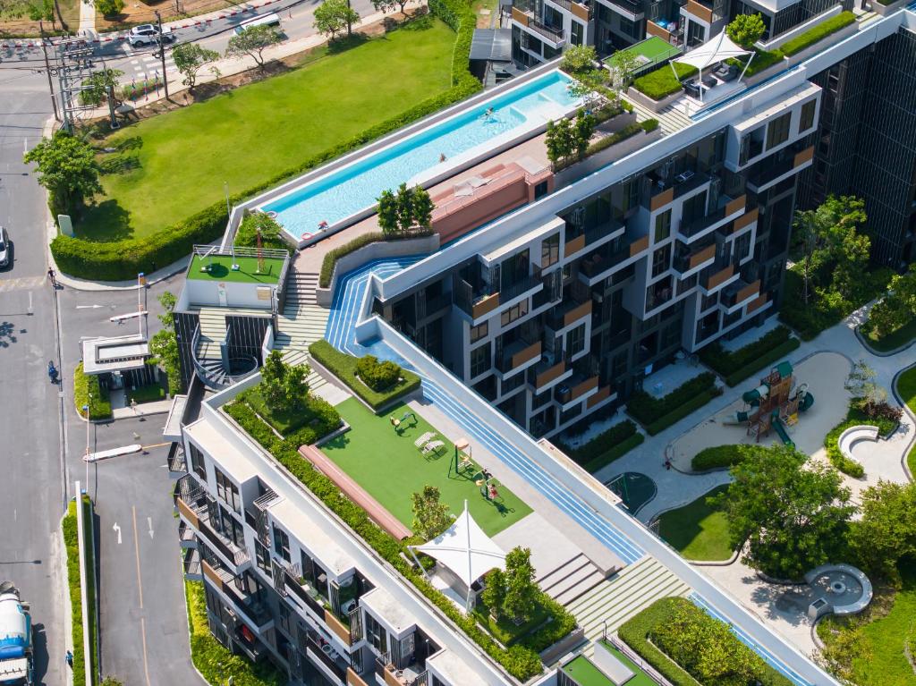 an overhead view of a building with a swimming pool at Skypark Laguna Rooftop Pool Apartment near Bang Tao Beach in Bang Tao Beach