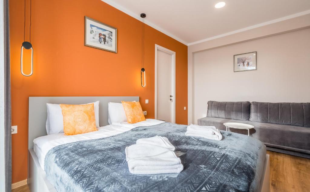 Postel nebo postele na pokoji v ubytování New Gudauri Apartments