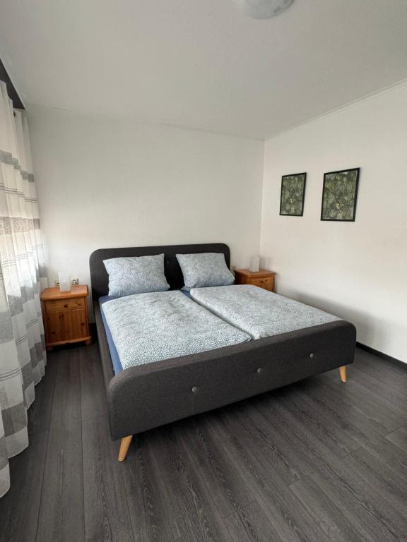 Postel nebo postele na pokoji v ubytování Gästehaus Zur Schmiede