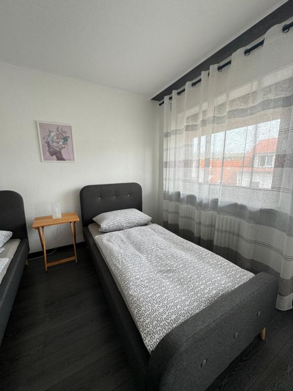 Postel nebo postele na pokoji v ubytování Gästehaus Zur Schmiede