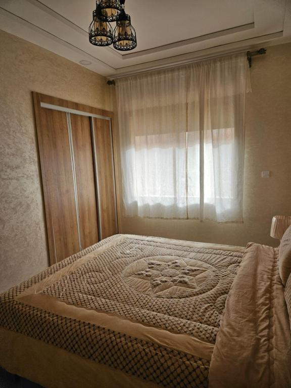 Postel nebo postele na pokoji v ubytování Green house , les couples non mariés merci de s'abstenir