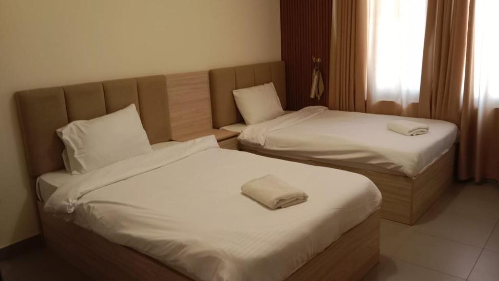 Giường trong phòng chung tại Apartment F34 - Samarah Resort