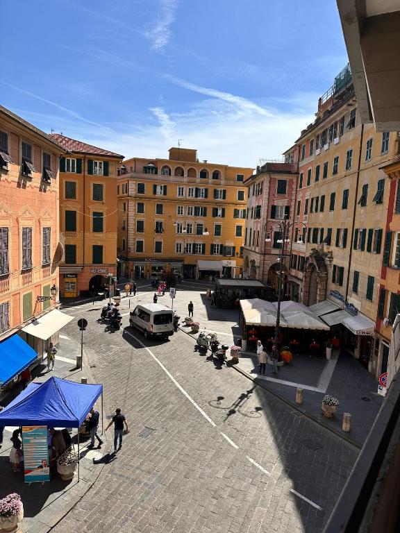 a city square with a street with people and buildings at Palma Residence Rapallo by PortofinoVacanze in Rapallo