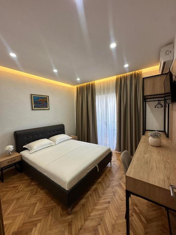 Postel nebo postele na pokoji v ubytování Apartments Basha 1 - Long Beach