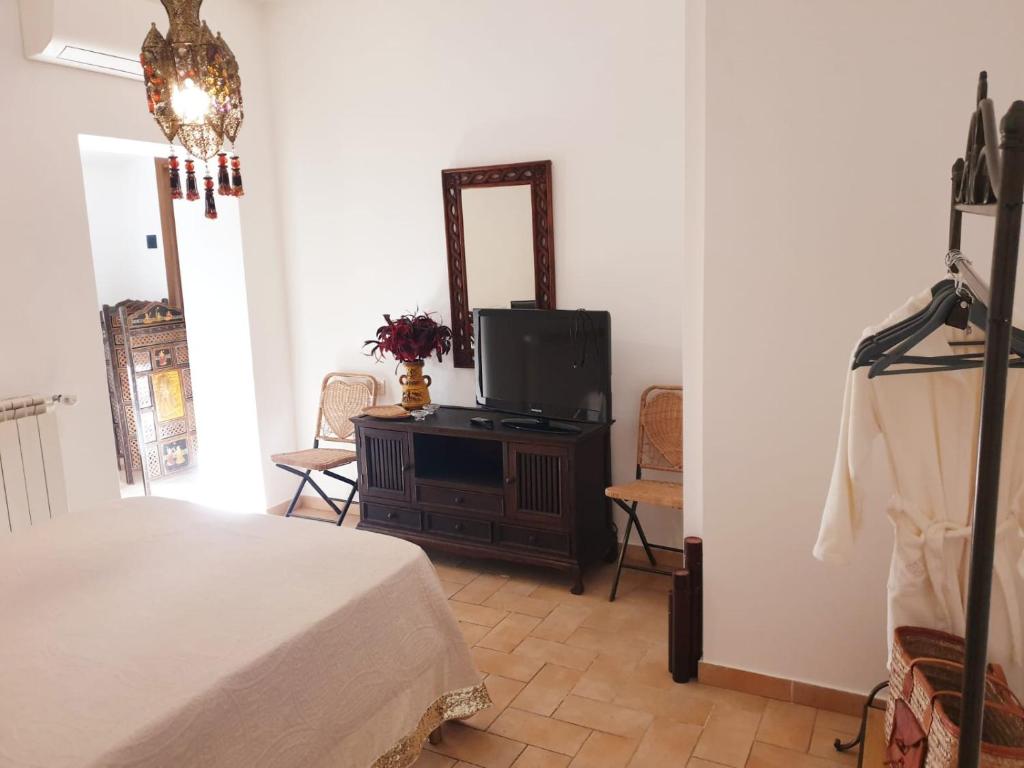 Postel nebo postele na pokoji v ubytování Il Ninfeo " le cocon" appartamento
