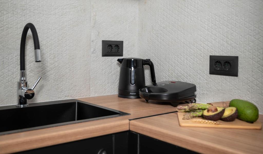 Kuchyň nebo kuchyňský kout v ubytování Casa D' Amore Urban Studio