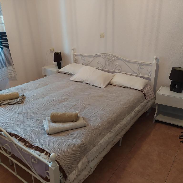 Postel nebo postele na pokoji v ubytování Nymph